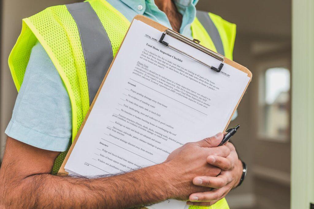 Person Holding Maintenance Checklist